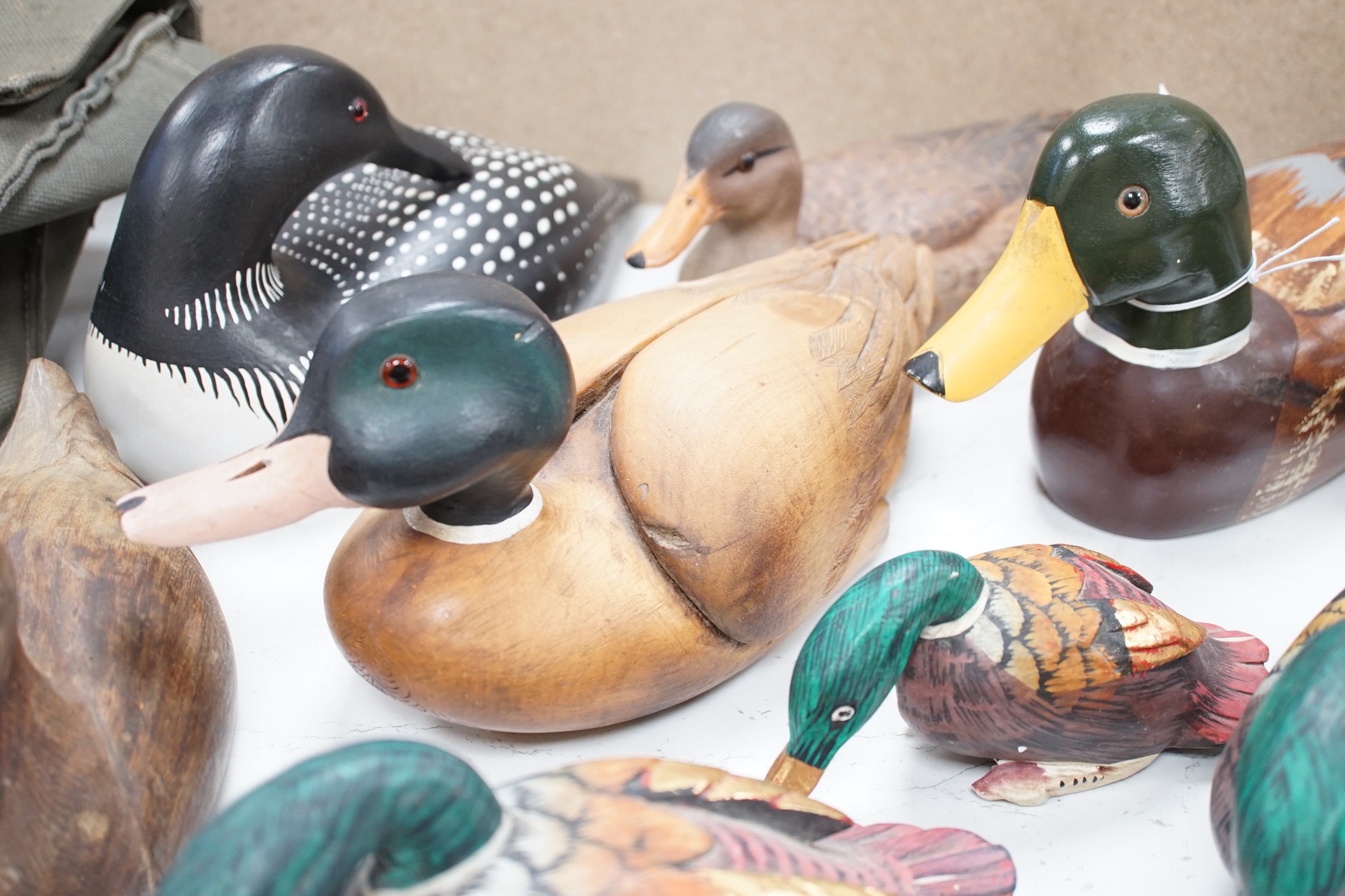 Nine carved wood decoy ducks